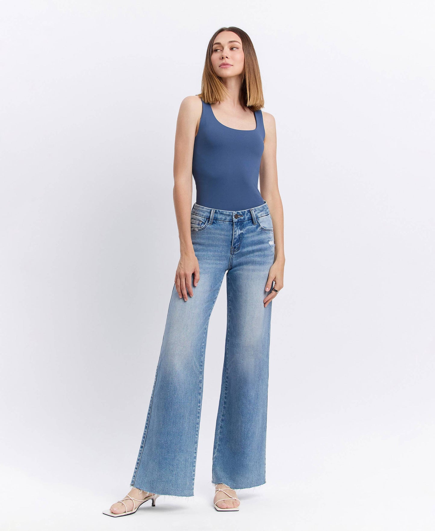 MID RISE CLEAN CUT RAW HEM WIDE JEANS